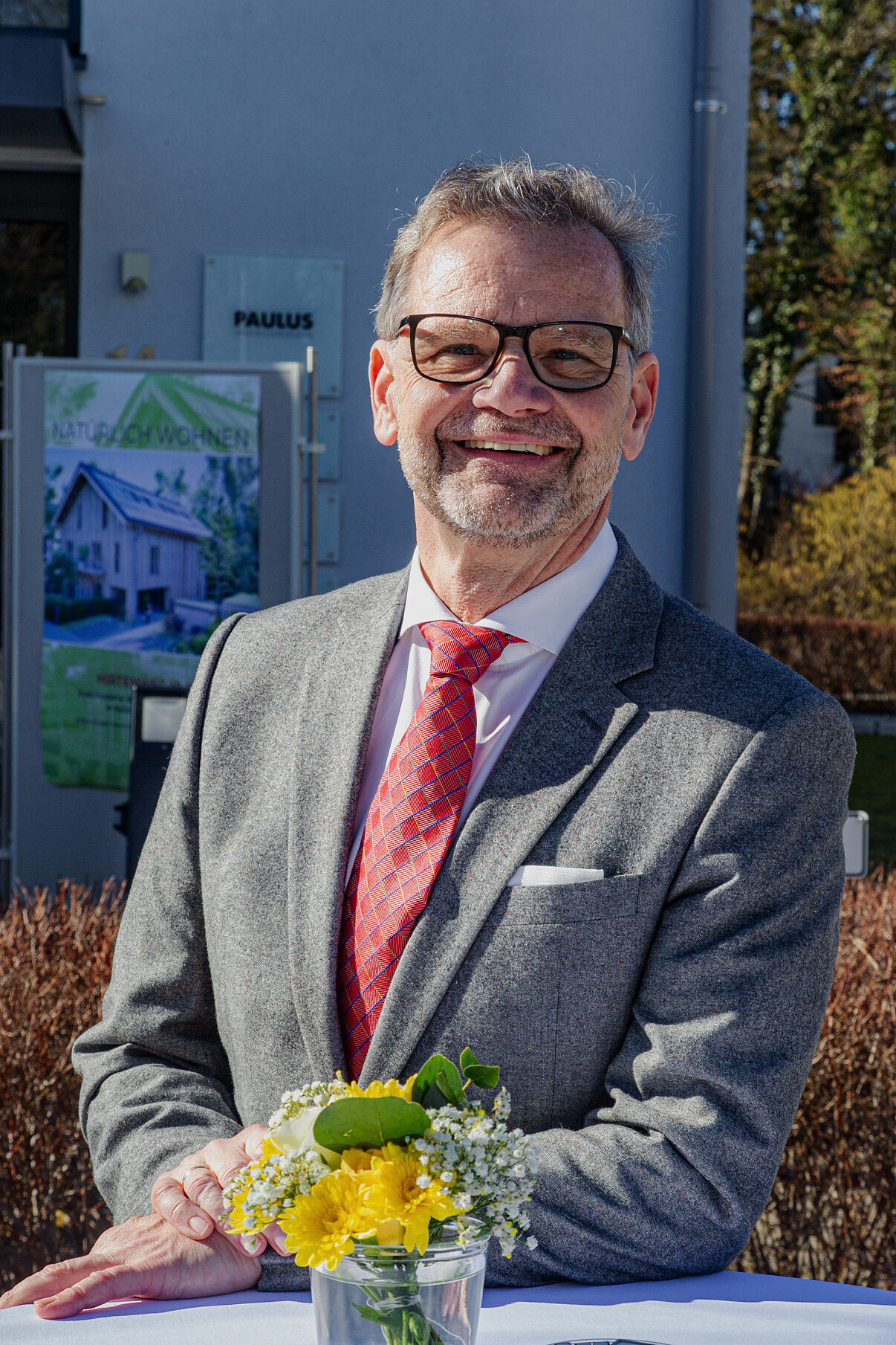 Herr Christian Paulus beim Spatenstich für grünes Wohnbauprojekt in Grünwald am 25. Februar 2026 