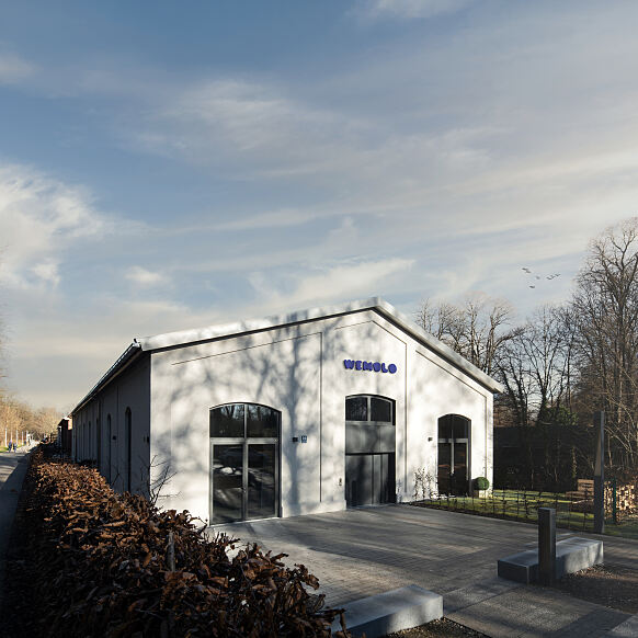 Neuer Wemolo-Standort am Isarwinkel in München-Thalkirchen: Das Ensemble aus revitalisierter Triebwagenhalle und Neubau liegt in unmittelbarer Nähe zur Isar.
