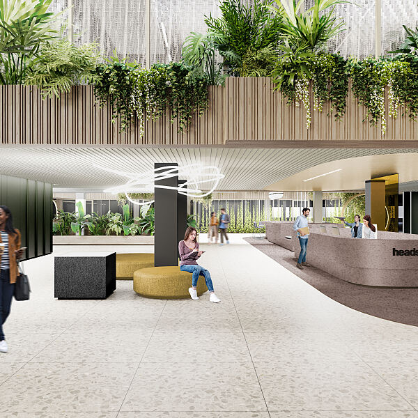 Sitzmöglichkeiten, viele Pflanzen, ein offener Raum, Human Centric Lighting und Concierge-Service: Im HEADS sollen Gebäudenutzer gern ankommen.